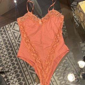 Body suit in a size medium